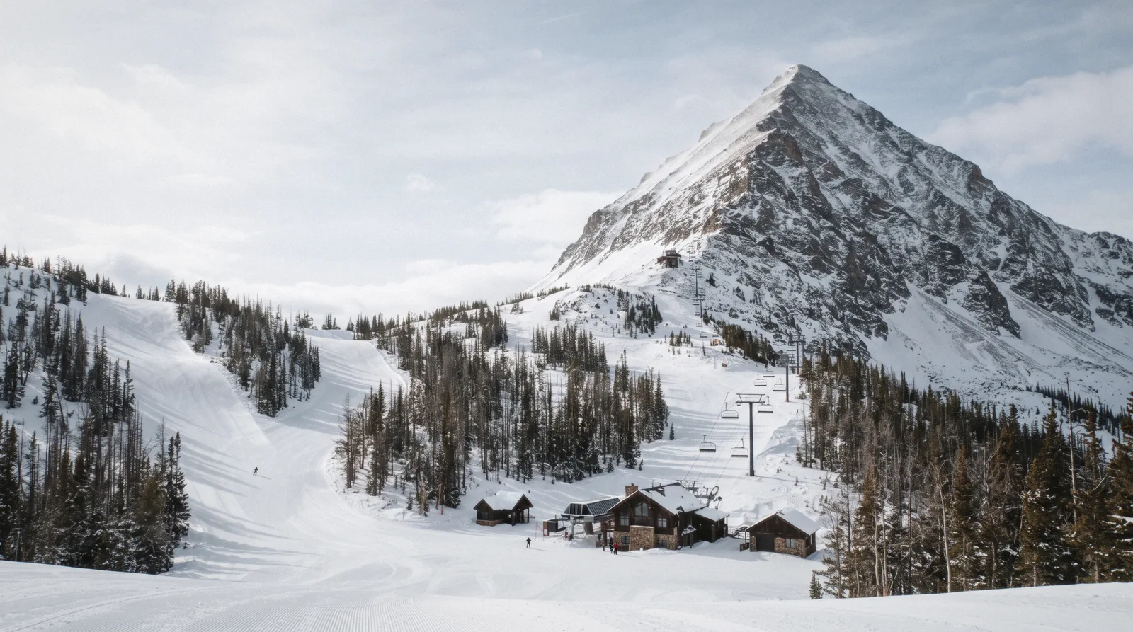 Lone Peak above the Mountain Village base at Big Sky, Montana, where the ski-in ski-out hotels cluster