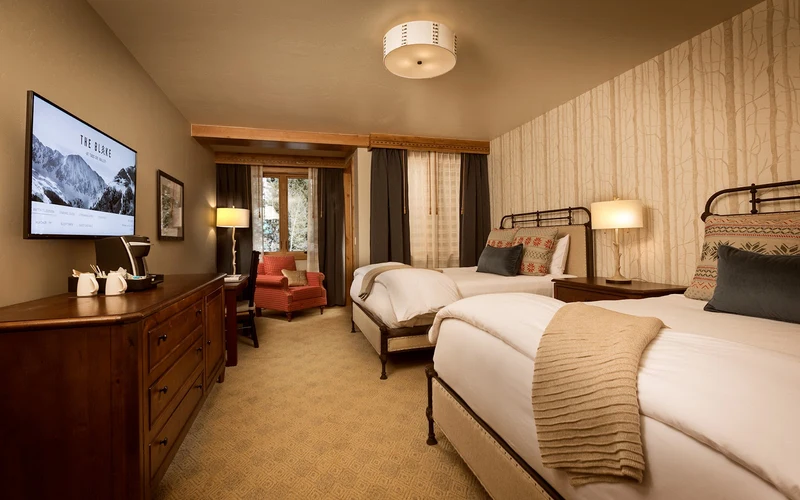 The Blake hotel on Sutton Place at the foot of Lift 1, walk-to-the-lift lodging beside the ski-in ski-out addresses at Taos Ski Valley, New Mexico