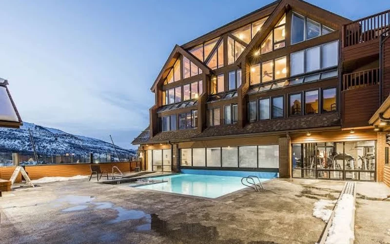 Condominium buildings at The Lodge at Mountain Village next to the PayDay Express lift at a ski-in ski-out hotel in Park City, Utah
