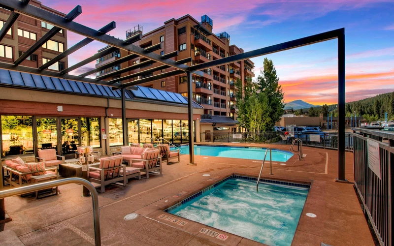 The Village at Breckenridge condominiums beside the Peak 9 base and Maggie Pond in Breckenridge, Colorado