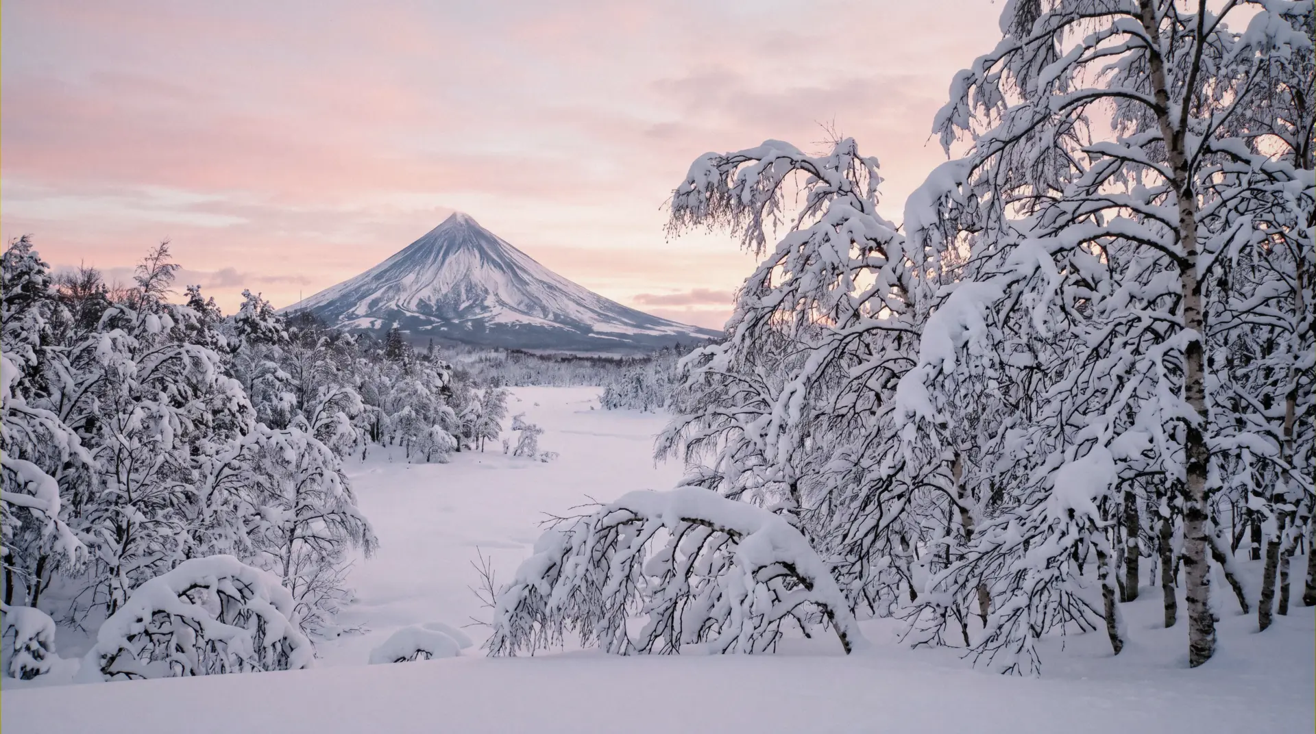 Mount Yotei behind the snow-loaded slopes of Grand Hirafu, where the ski-in ski-out hotels in Niseko sit on the hill