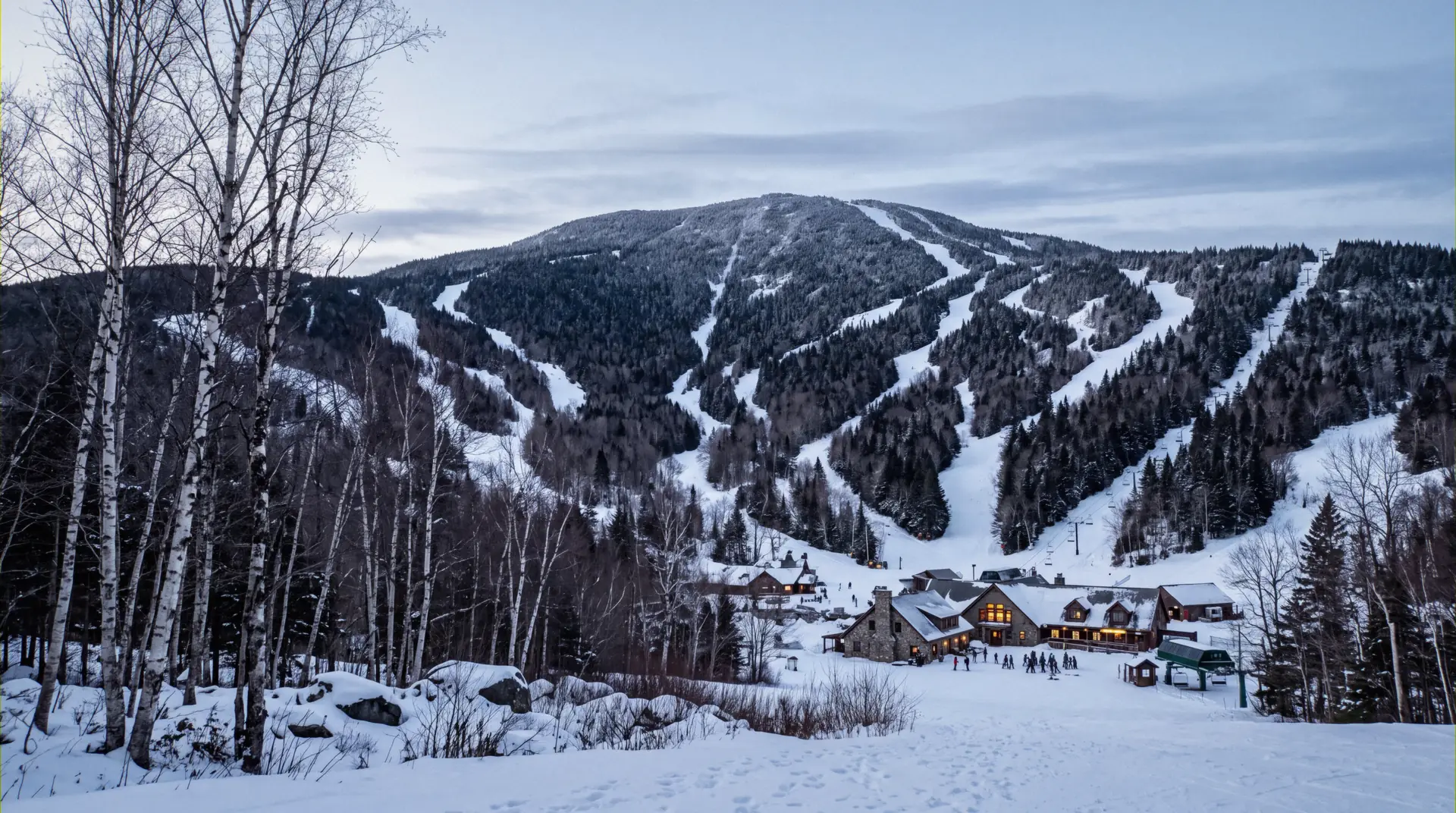 Mount Mansfield above the Spruce Peak base in Vermont, where the ski-in ski-out lodging at Stowe sits