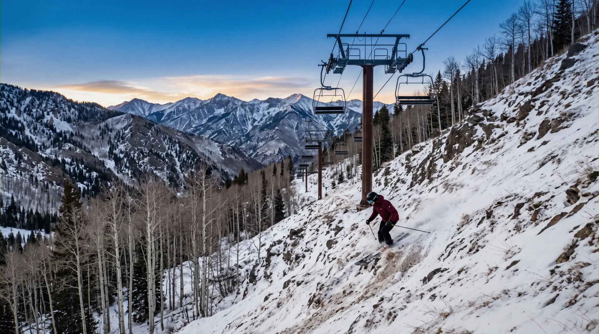 Taos Ski Valley under fresh snow in New Mexico, the base plaza and Lift 1 below the ridge, where the ski-in ski-out lodging at Taos sits
